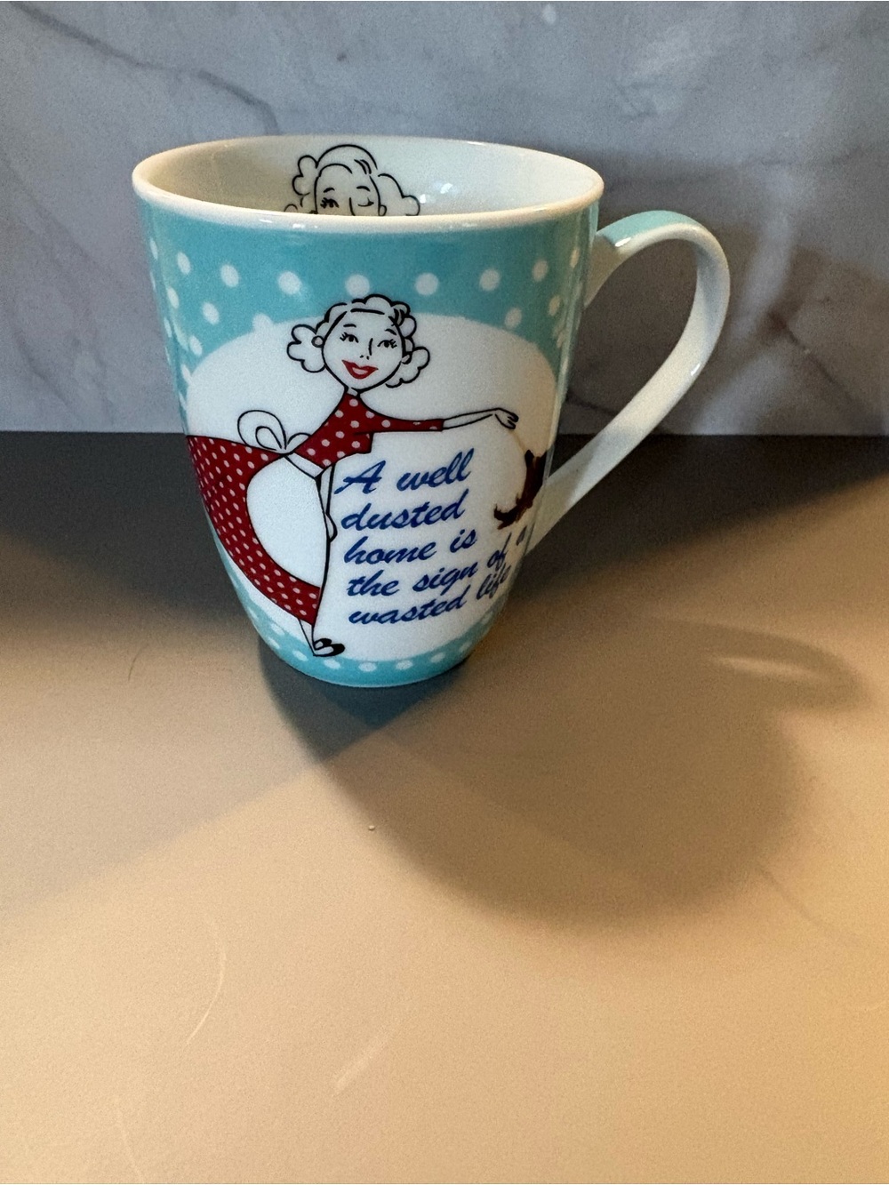 Blue Polka Dot Ceramic Mug with Retro Housewife Design